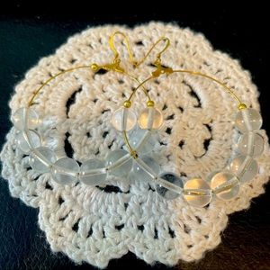 Golden hoop earrings with crystal stones